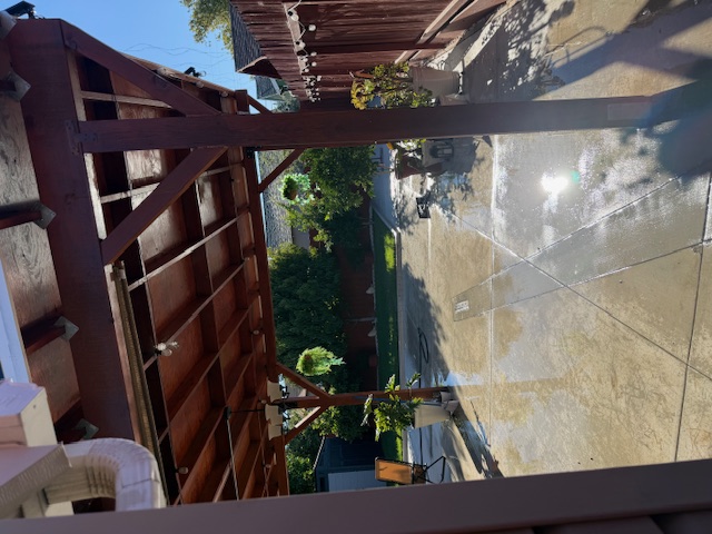 Concrete driveway beneath a covered outdoor area at an Antioch home